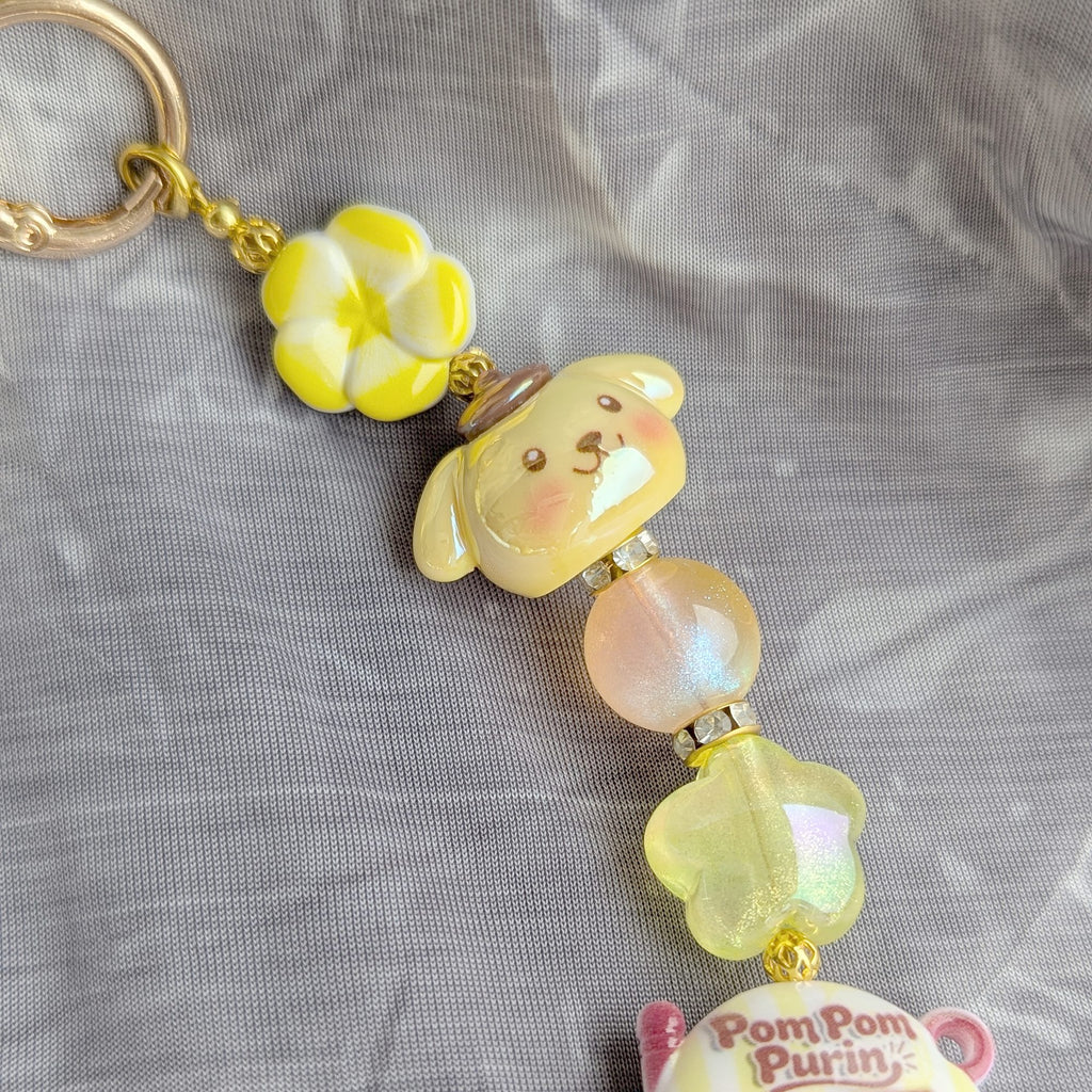 Pompompurin Yellow Beaded Bag Charm - close-up
