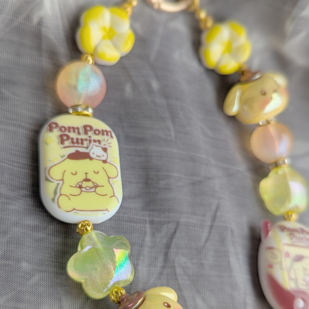 Pompompurin Yellow Beaded Bag Charm - close-up