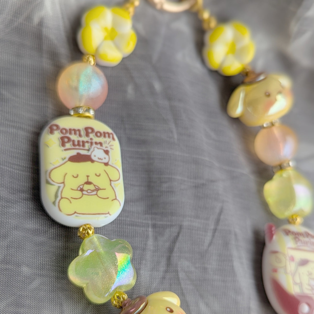 Pompompurin Yellow Beaded Bag Charm - close-up